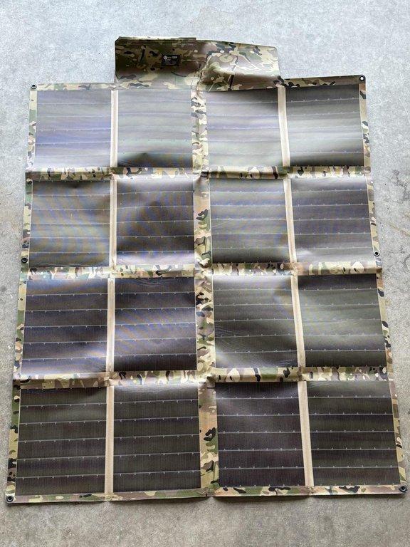 Folding solar panel deployed on the ground